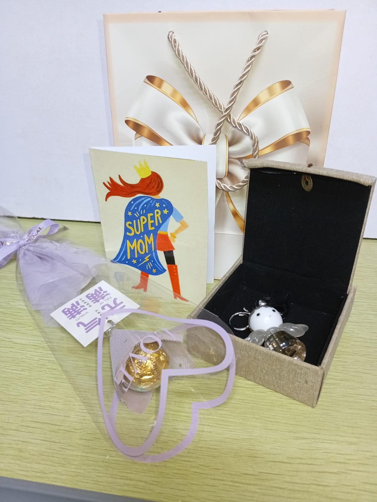 Chocolate wrap , angel keyring, gift card , gift bag )