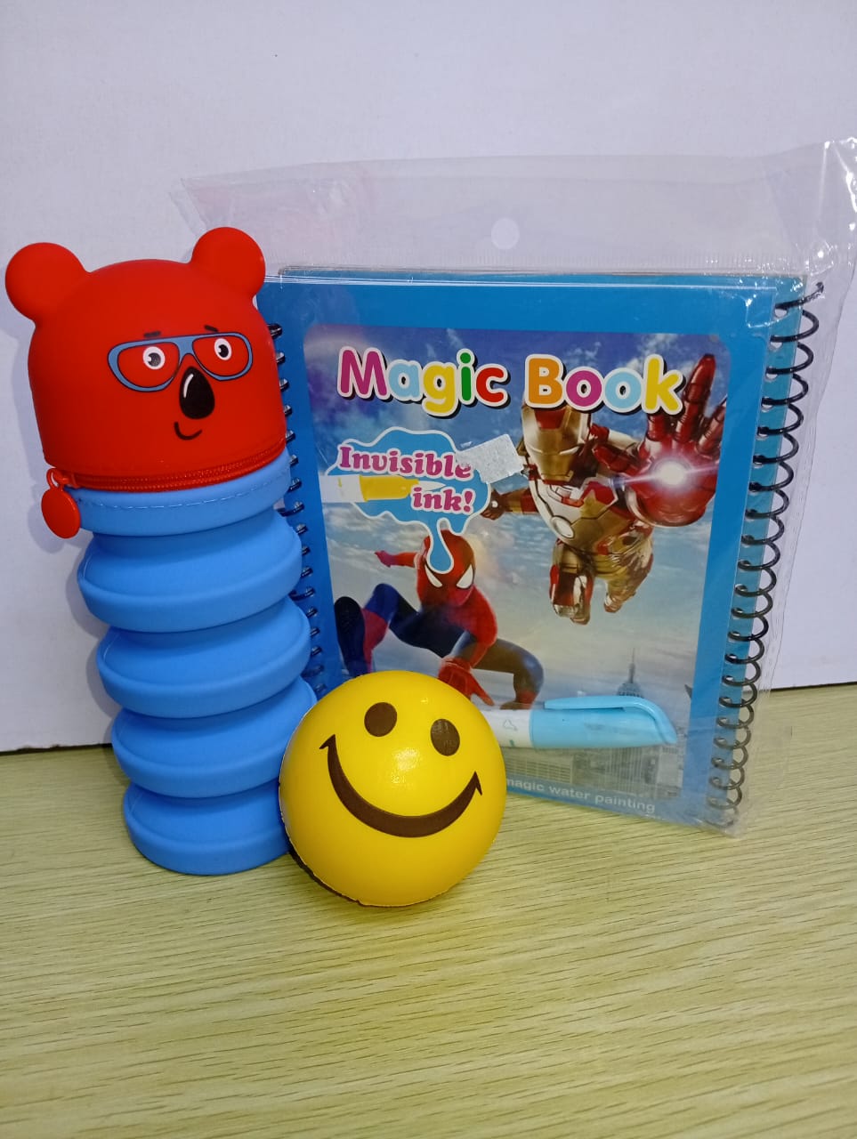 Magic book , pencil pouch ,  press ball. + Free gift card